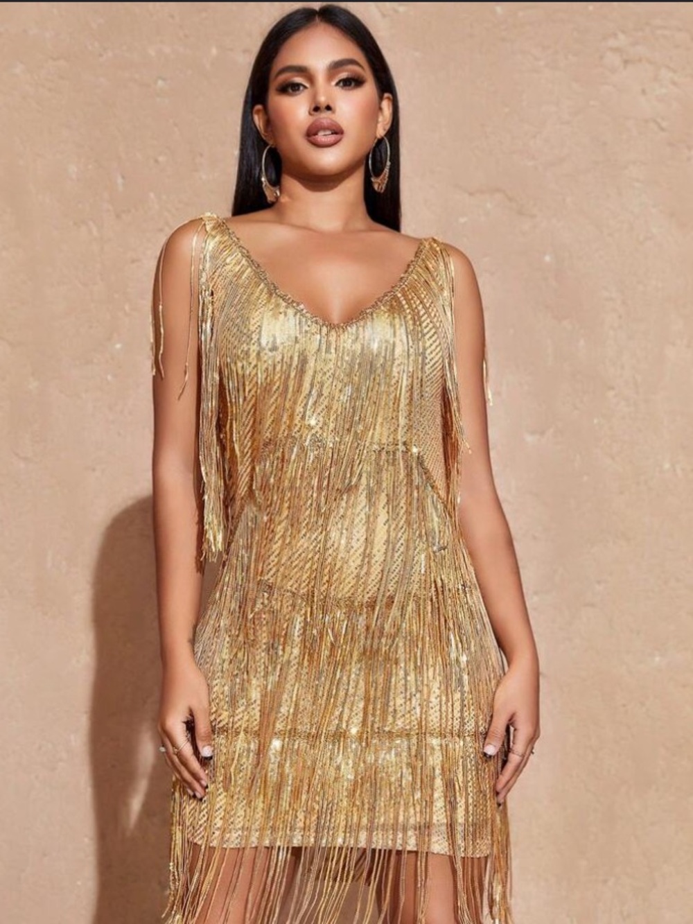 gold sequin-embellished 1920s-style flapper dress featuring layered tassel
